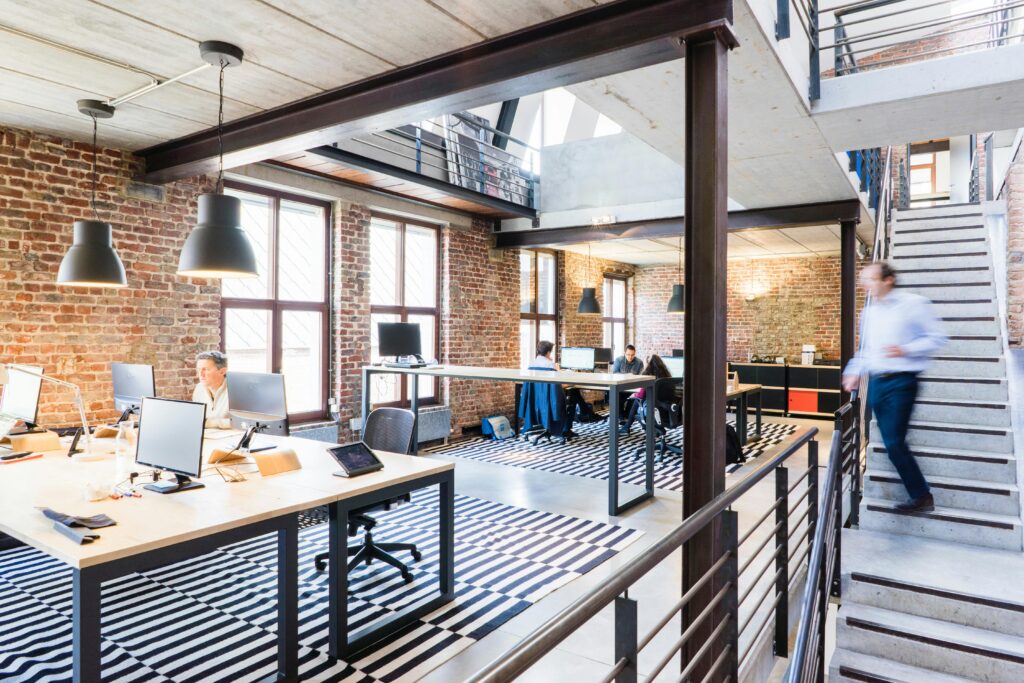 pexels-photo-2451566-2451566 Spacious and stylish open-plan office with loft and industrial aesthetic.